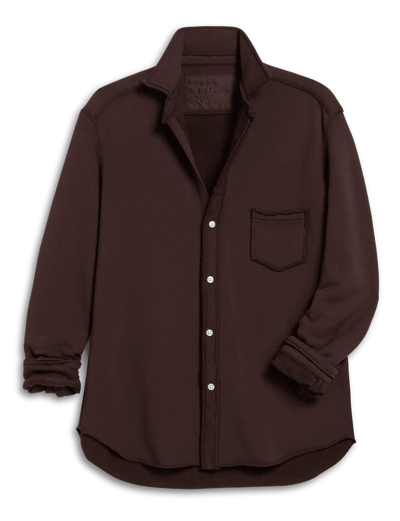 The Frank & Eileen Eileen Button Up Shirt F25 is a relaxed fit, long-sleeve dark brown shirt with a chest pocket and subtly frayed edges, exuding effortless California style on a crisp white backdrop.