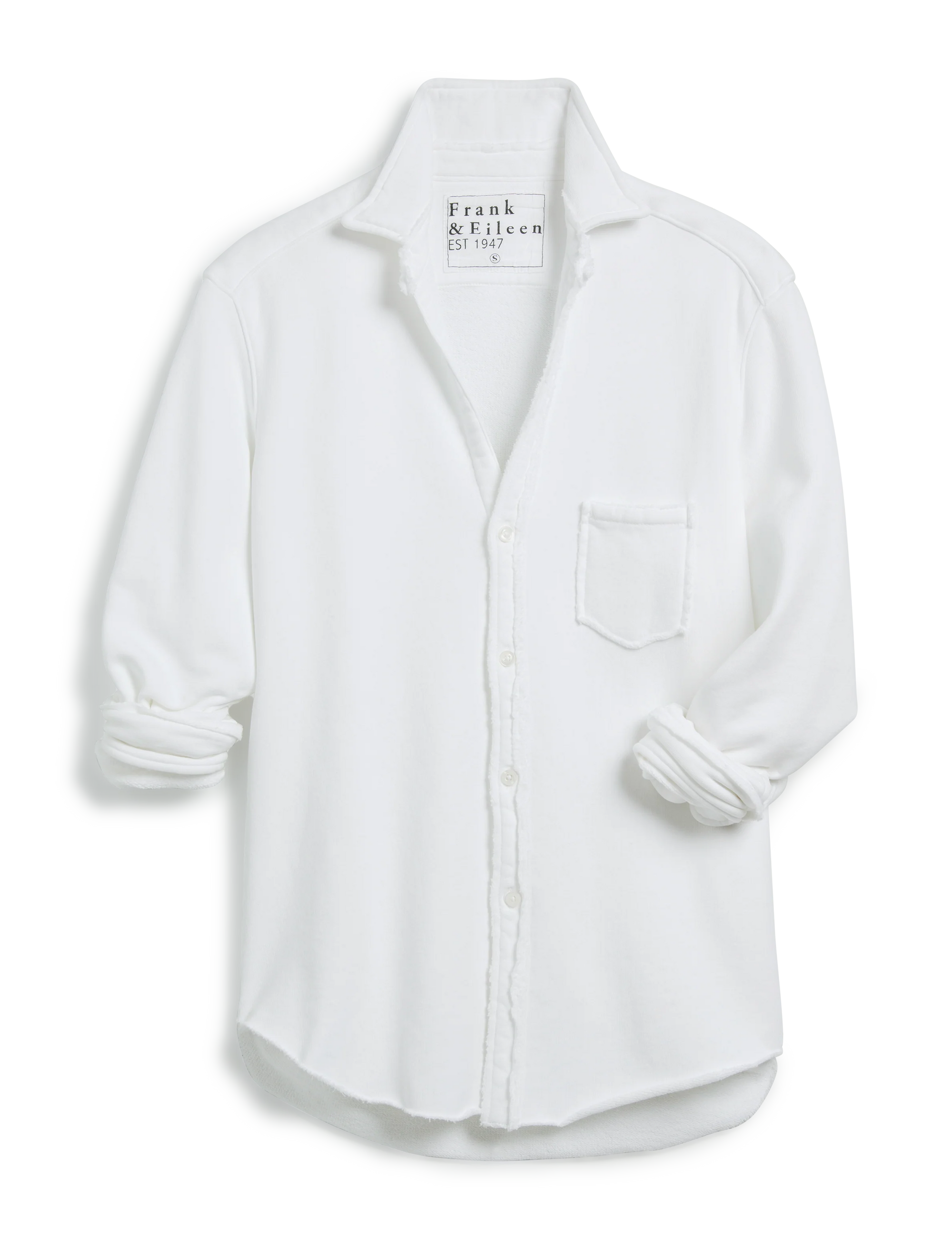 The Frank & Eileen Eileen Sweatshirt Button Up is a white, relaxed-fit long sleeve shirt with a single chest pocket and rolled-up cuffs displayed on a white background. The tag reads "Frank & Eileen EST 1947," highlighting bust-flattering buttons.