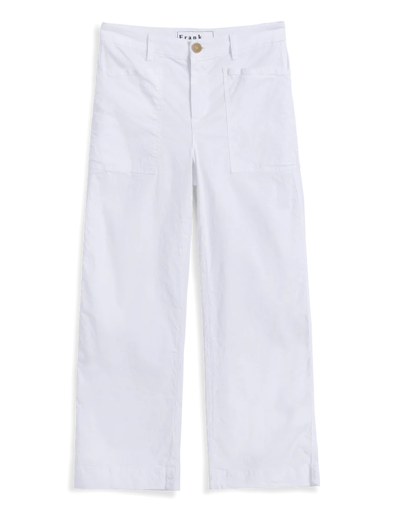 The Frank & Eileen Limerick Carpenter Pant is a white high-waisted, wide-leg utility pant with button and zipper closure, belt loops, and visible front pockets, shown laid flat on a white background.