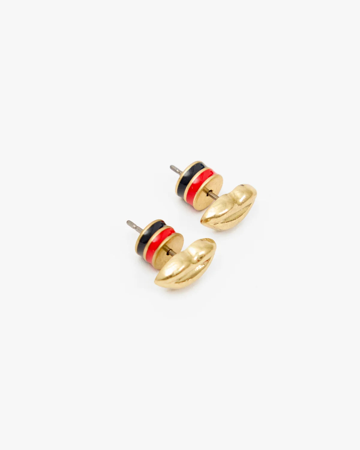 Gold-plated brass lips stud earrings with black and red enamel stripes by Clare Vivier on a white background.