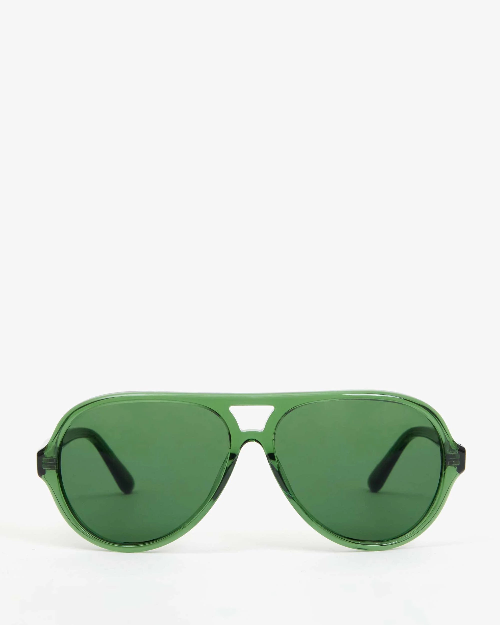 The Lizzie Sunglasses by Clare Vivier feature green aviator frames and dark lenses, set against a plain white background and providing UVA/UVB protection.