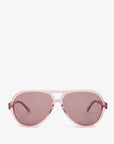 The Lizzie Sunglasses by Clare Vivier are pink aviator shades made from recycled materials, featuring slightly tinted lenses offering UVA/UVB protection. They're showcased front-view against a plain white background.