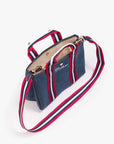 Denim tote with red, white, and blue strap and Mother embroidery on front by Mother.