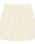 The Ines De LA Fressange Summer Skirt is a cream A-line style with front patch pockets and a wide waistband, made from soft terry cotton and shown on a white background.