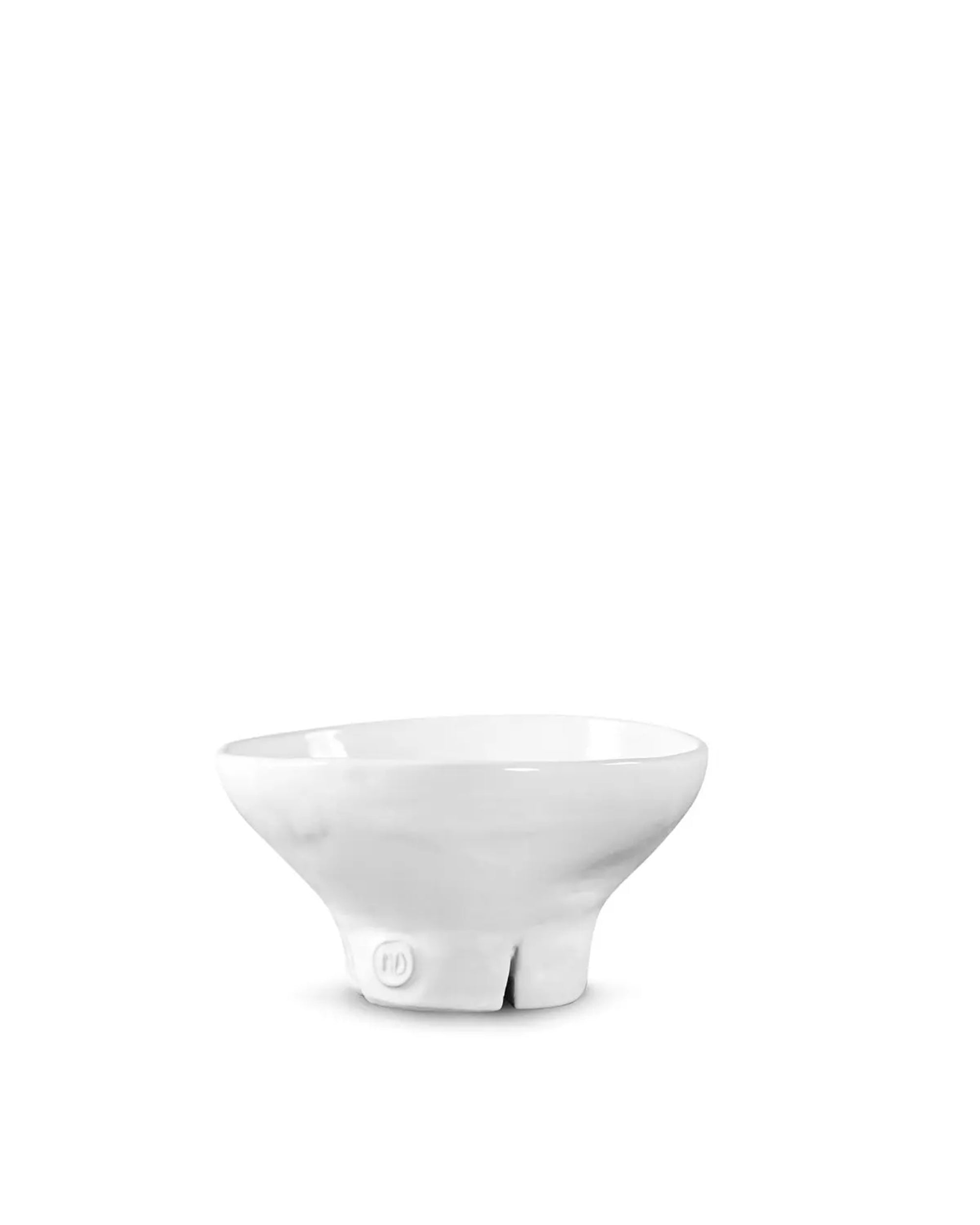 The Catchall Bowl No 257 by Montes Doggett is a white, high-fired ceramic bowl with an irregular, slightly uneven shape and a small split at the base, shown against a plain white background.