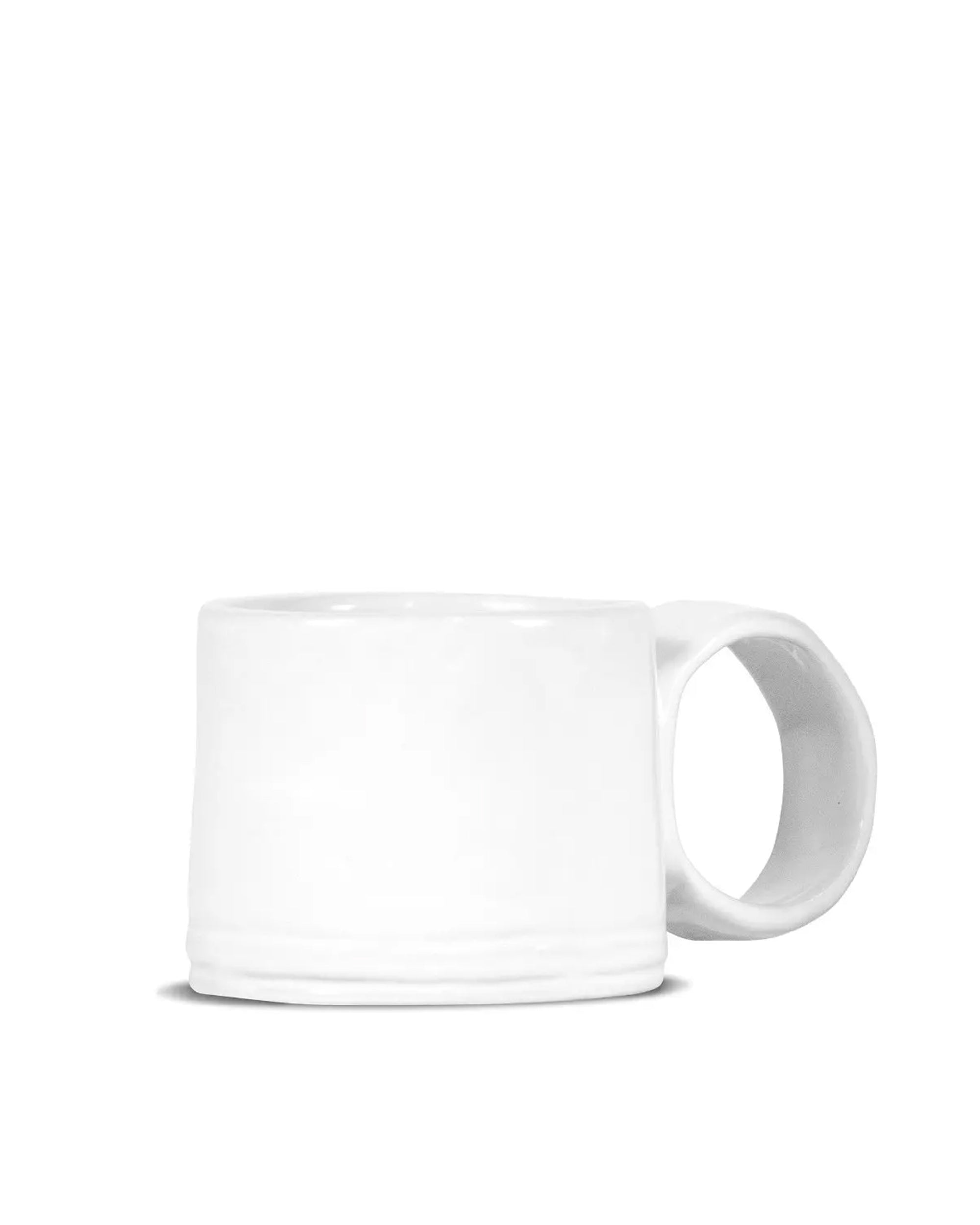 The Montes Doggett 4926 Espresso Cup 926 is a white, microwave-safe ceramic mug shown on its side with the handle to the right against a plain white background.