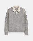 The Highland Collared Sweater by Alex Mill is a long-sleeved, black and white horizontally striped sweater crafted from soft merino wool. It features a cream-colored collar and a shell button placket, adding a touch of contrast to the cozy design. The sweater is showcased against a plain white background.