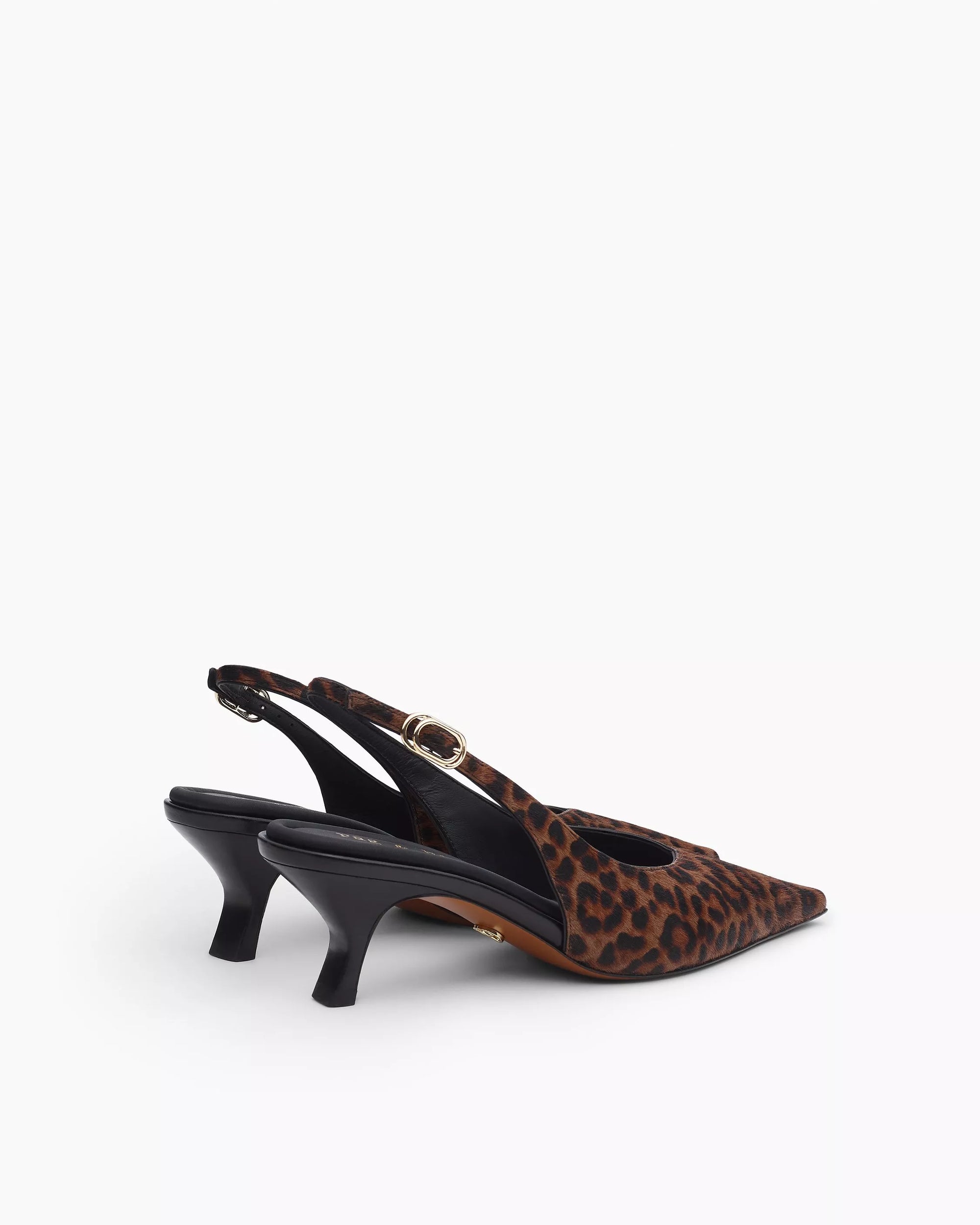 Step out in style with the Rag & Bone madison slingback heel, featuring a leopard print, low black kitten heel, gold buckle strap, and cushioned OrthoLite foam insoles for all-day comfort.