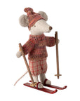 The Maileg Winter Mouse by Maileg features a festive mouse in a red knit hat, matching sweater, and plaid pants on red skis with wooden ski poles—perfect for adding holiday cheer to your decor.