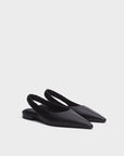 The Rag & Bone mercer slingback flat—a pair of black leather pointed-toe flats with cushioned footbeds, elastic back straps, and low heels—is displayed on a white background.