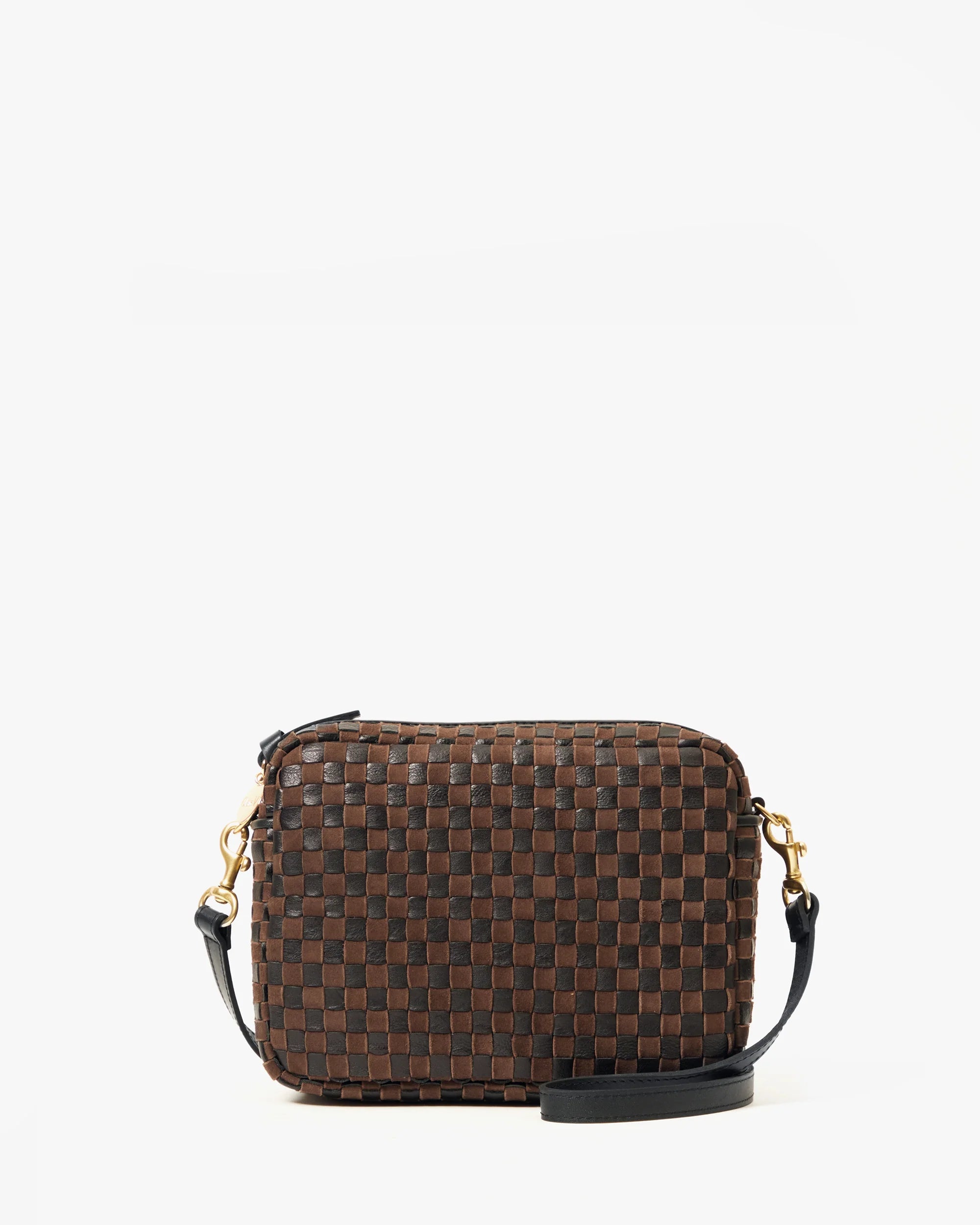 The Clare Vivier Midi Sac S25 is a small handwoven leather crossbody bag in a dark brown and black checkered pattern, featuring a detachable black strap with gold-tone hardware, shown on a plain white background.