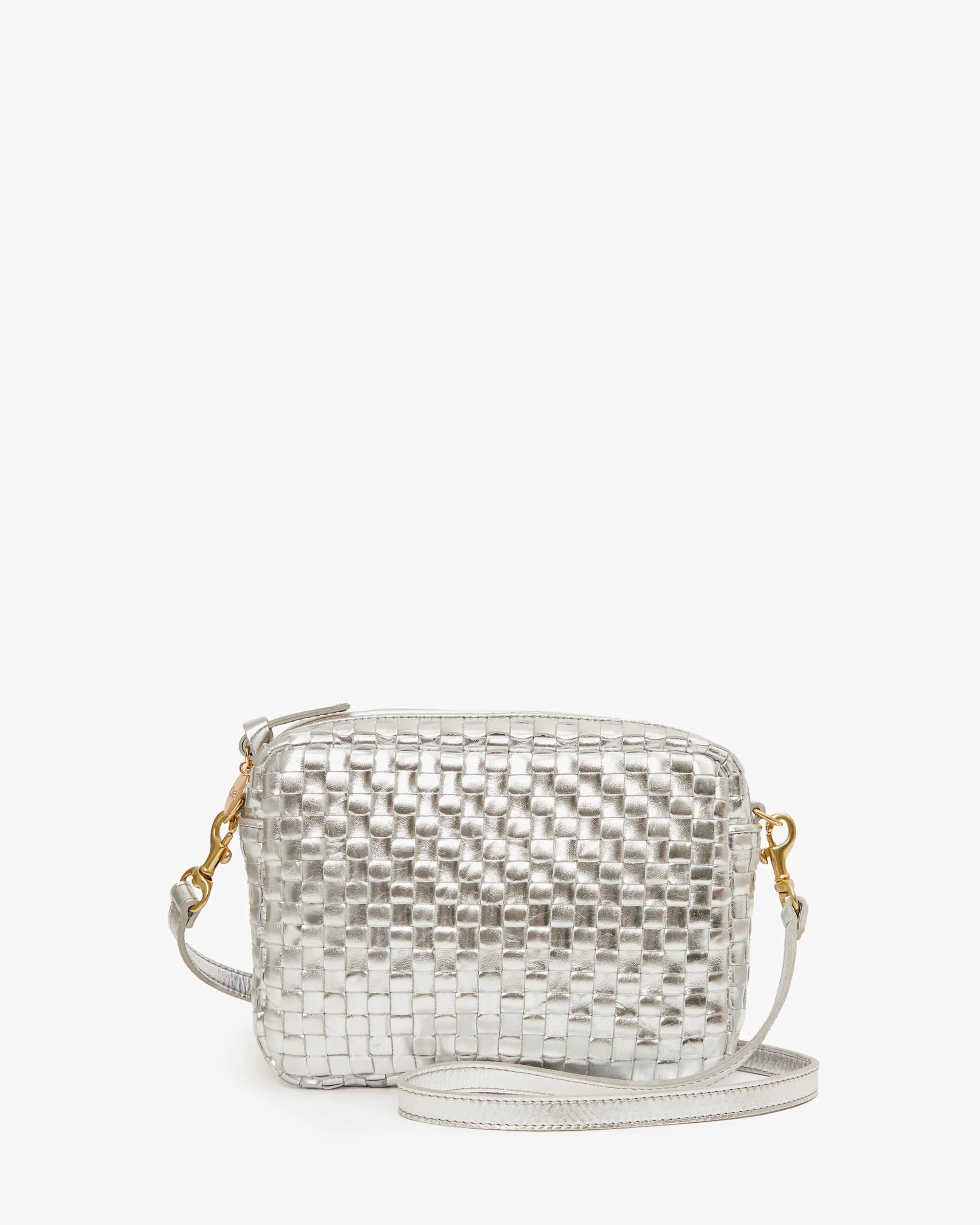 The Clare Vivier Midi Sac S25, a small handwoven leather crossbody bag with a silver metallic texture, gold hardware, and a matching silver strap, is displayed against a plain white background.