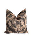 The Milo Pillow 22x22 by Rennah Collective features a beige background with bold black floral line art and large overlapping flowers on a soft polyester-linen cover.