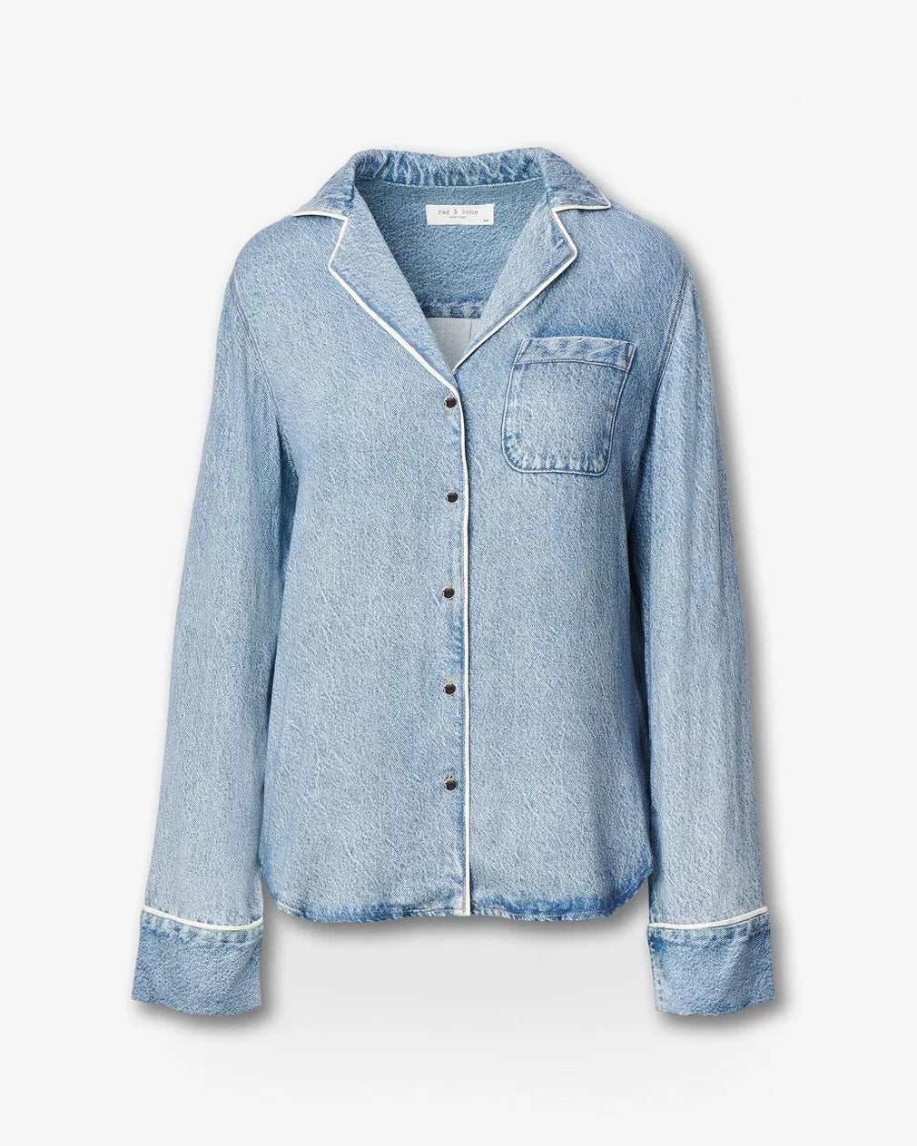 The Rag & Bone miramar slink long sleeve lounge shirt features a light blue denim print, single chest pocket, white piping, and soft texture, shown on a plain white background.