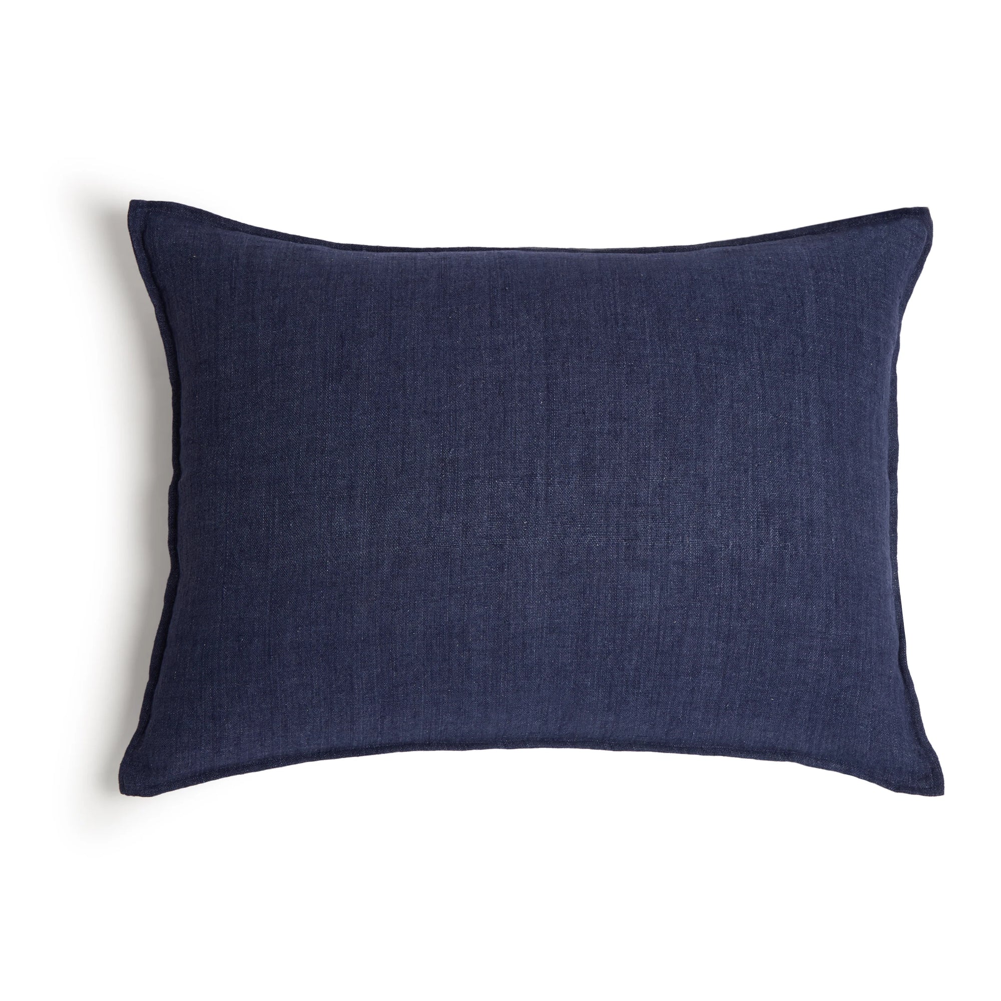 The Montauk Big Pillow 28x36 by POM POM is a rectangular, dark blue pillow made from heavyweight linen with a plain texture, shown against a white background.