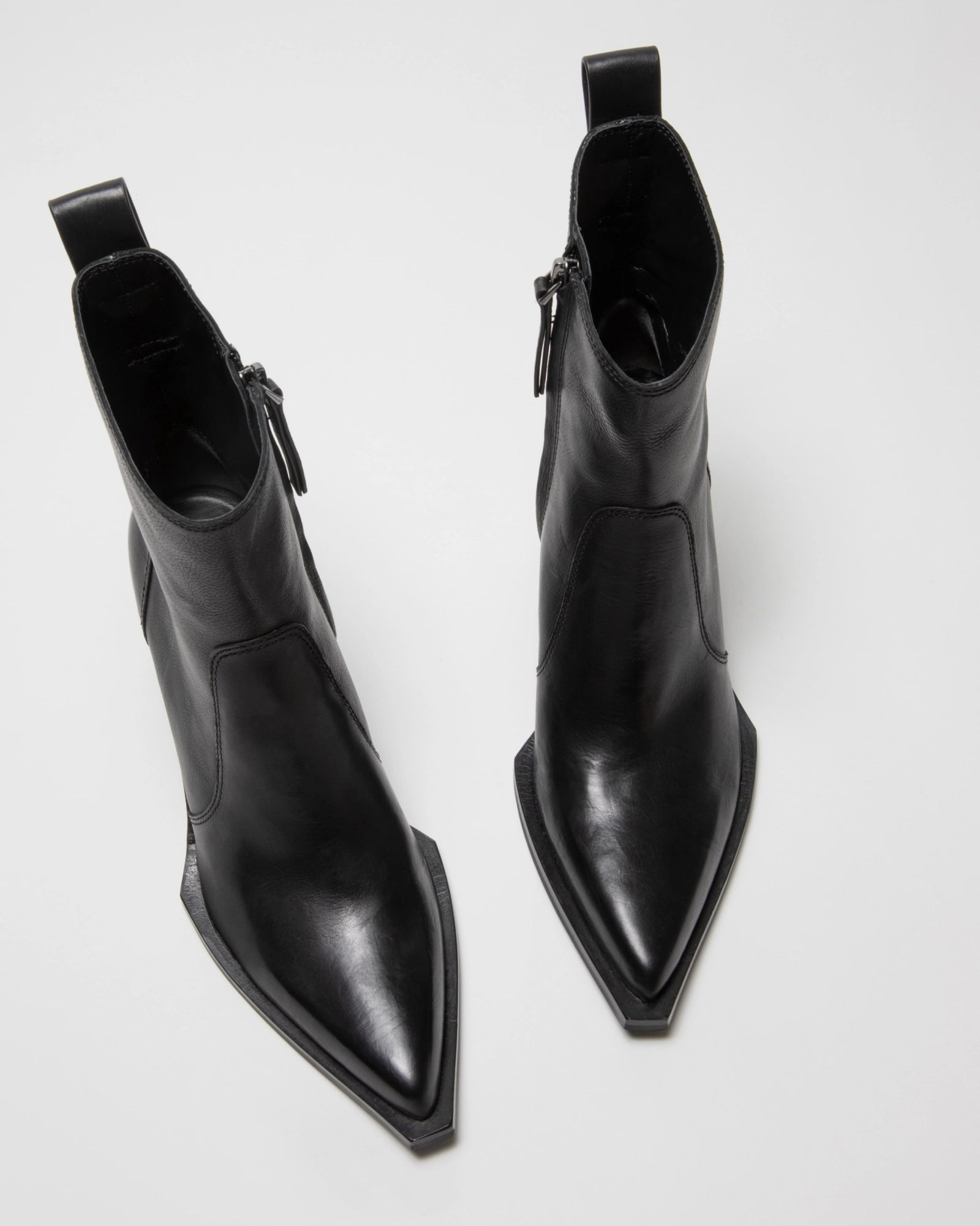 The ONCEPT Nashville Boot—black, genuine leather ankle boots with pointed toes, side zippers, and pull tabs—displayed on a light surface.