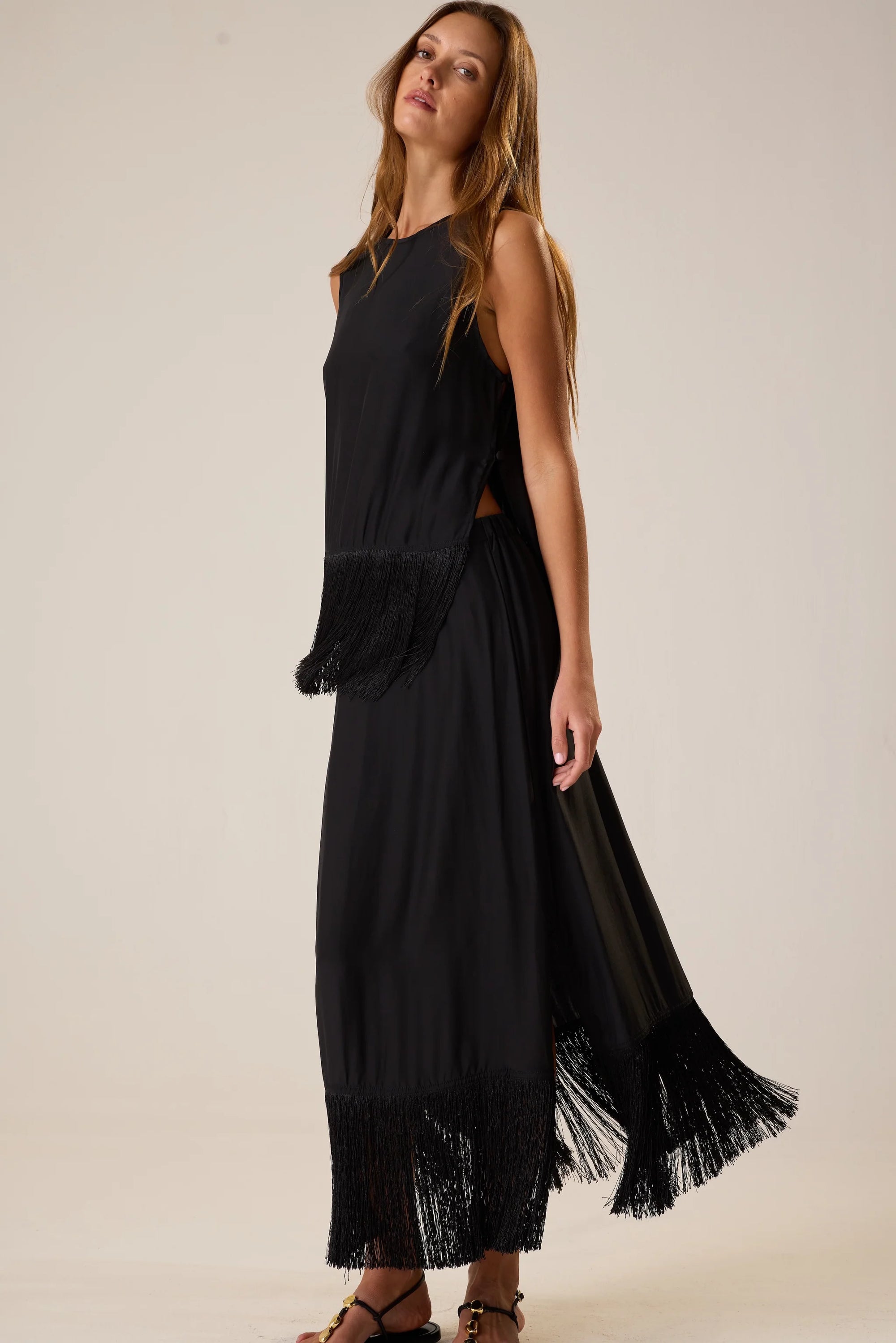 Sleeveless silk Jessie Top with fringe hem by Natalie Martin, styled sideways against a plain background.