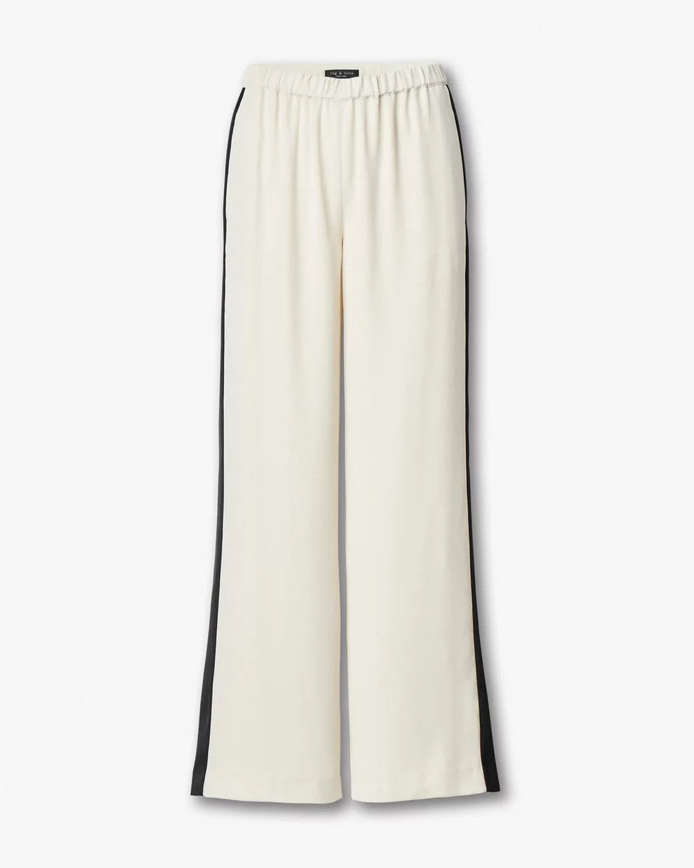 The Rag & Bone olivia stripe pant features a sporty wide-leg cream design with black vertical side stripes and an elastic waistband, shown against a plain white background.