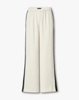 The Rag & Bone olivia stripe pant features a sporty wide-leg cream design with black vertical side stripes and an elastic waistband, shown against a plain white background.
