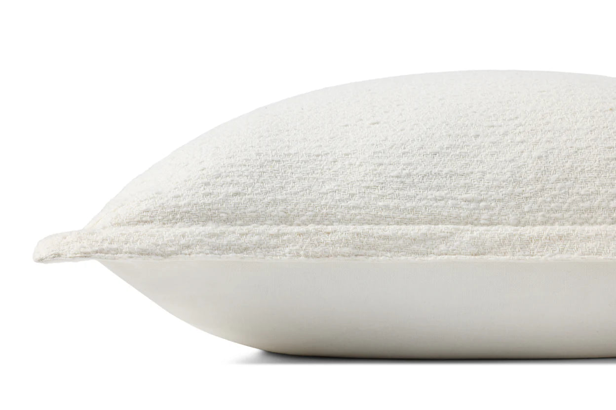 A close-up side view of the Loloi Rugs PCJ0022 Pillow 22x22 features a fluffy white textured fabric cover and ivory insert, displayed against a plain white background.