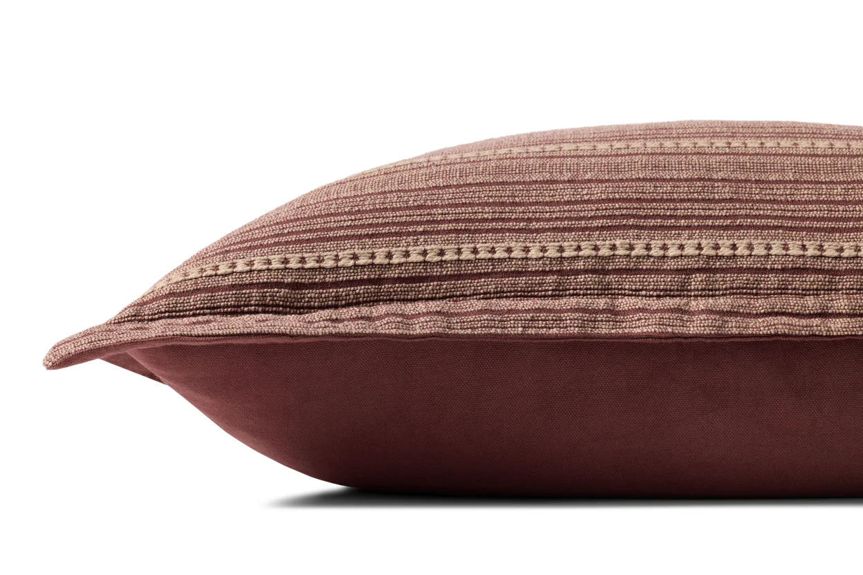 A side view of the Loloi Rugs PCJ0023 Howie Wine Pillow 13x21 shows its rectangular cotton build, textured striped brown and beige top, and solid brown bottom, set against a white background.