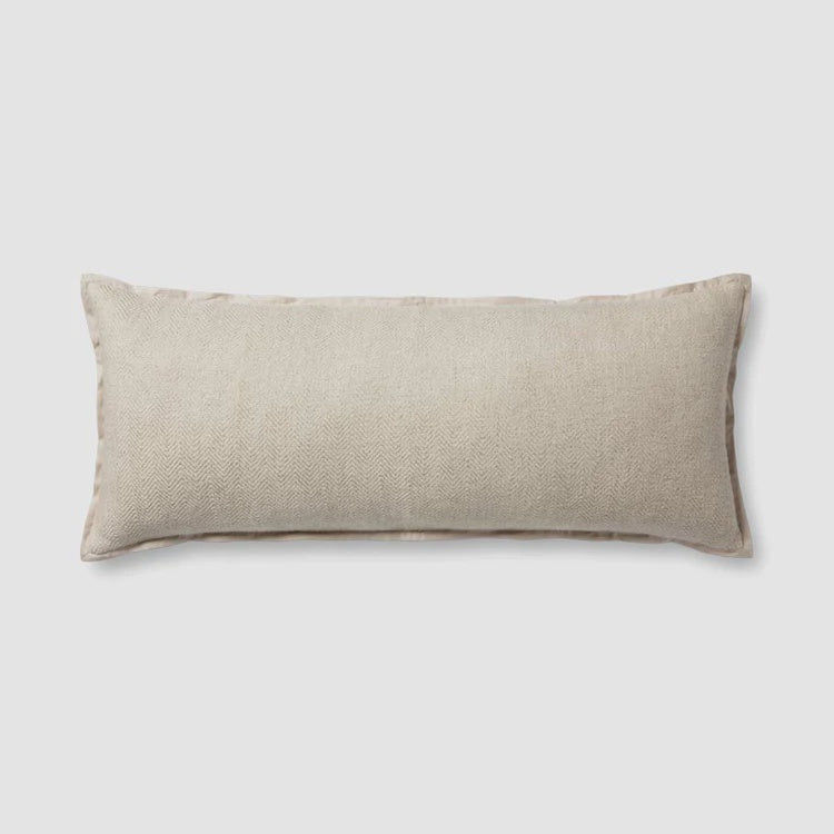 Introducing the Oatmeal Lumbar 13x35 from Loloi Rugs, a hand-stitched long pillow with a rectangular shape featuring a subtle herringbone pattern on a plain white background, crafted in India.