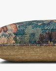 The Loloi Rugs Green/Multi 12x46 pillow features a textured, multicolored top with blue, green, and brown patterns, a solid light brown bottom, and a hidden flap zipper. Shown on a plain white background.