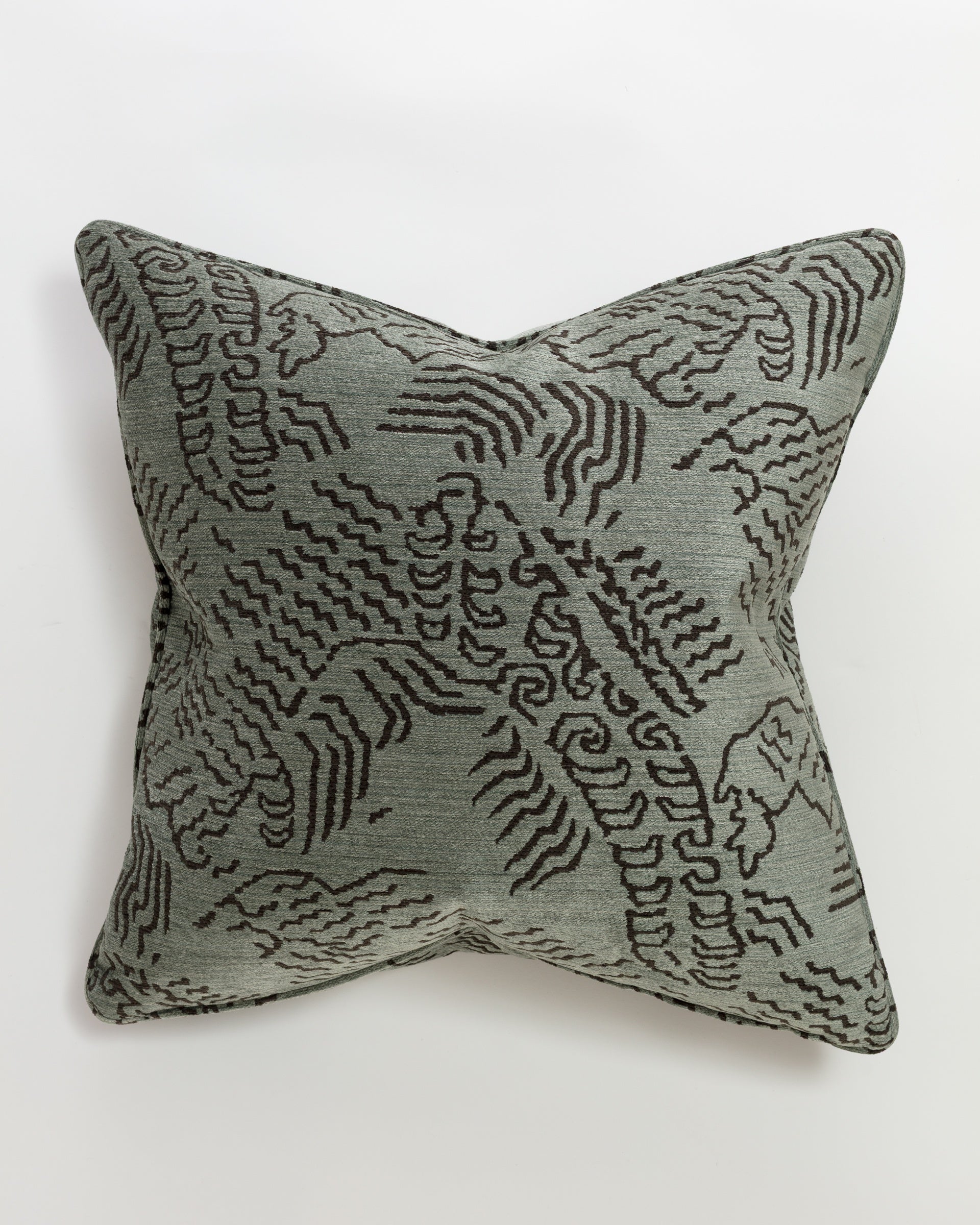 The Massoud Bereket Verdigris Pillow 26" features a textured gray fabric with an abstract black wave-like pattern on a white background. Filled with a down feather insert, its pointed corners give it a slightly concave appearance for an ultra-luxurious look.