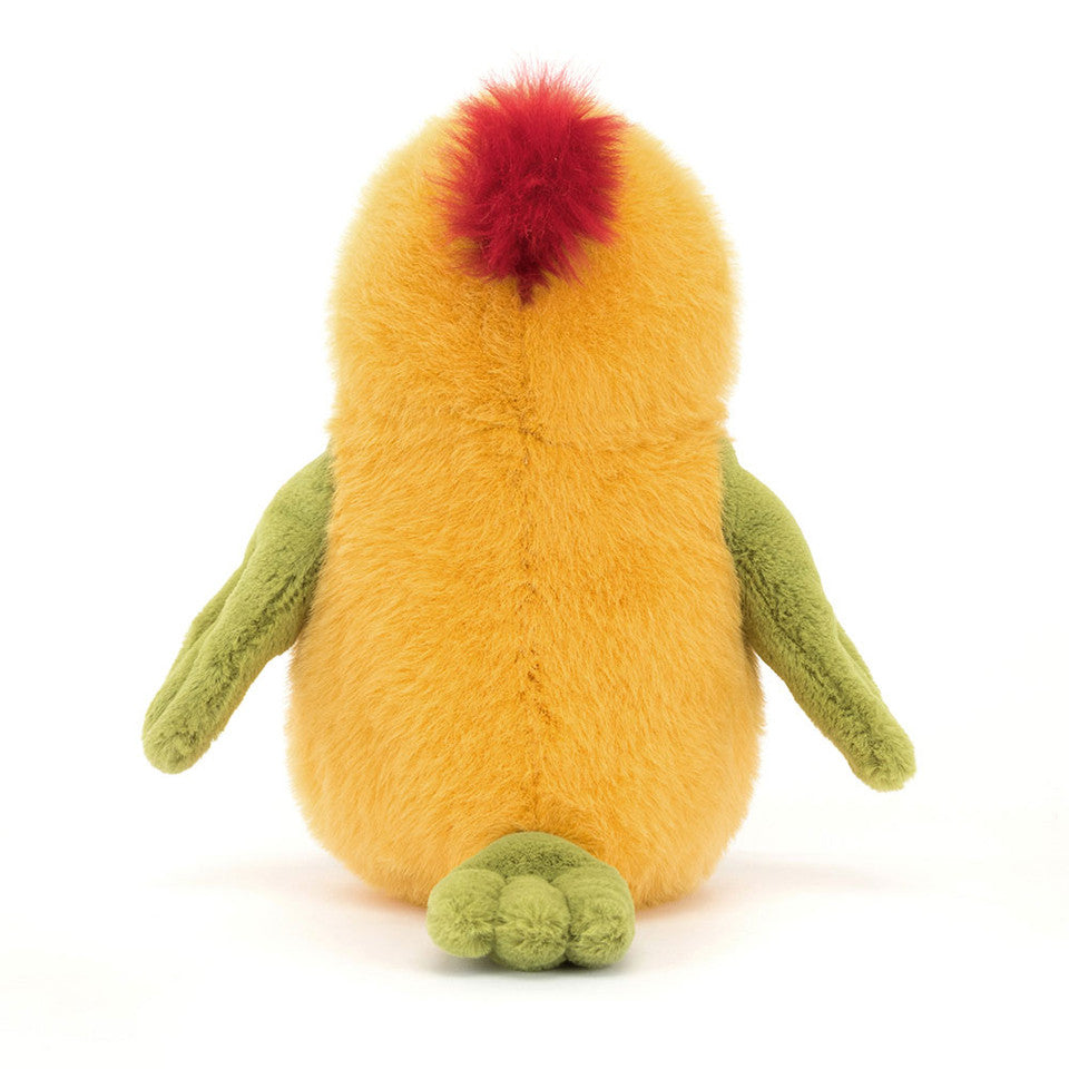 The Budgeby Parrot by Jelly Cat Inc. features yellow-orange fur, green parrot-like arms and feet, and a fluffy red tuft on top, shown from the back against a white background.