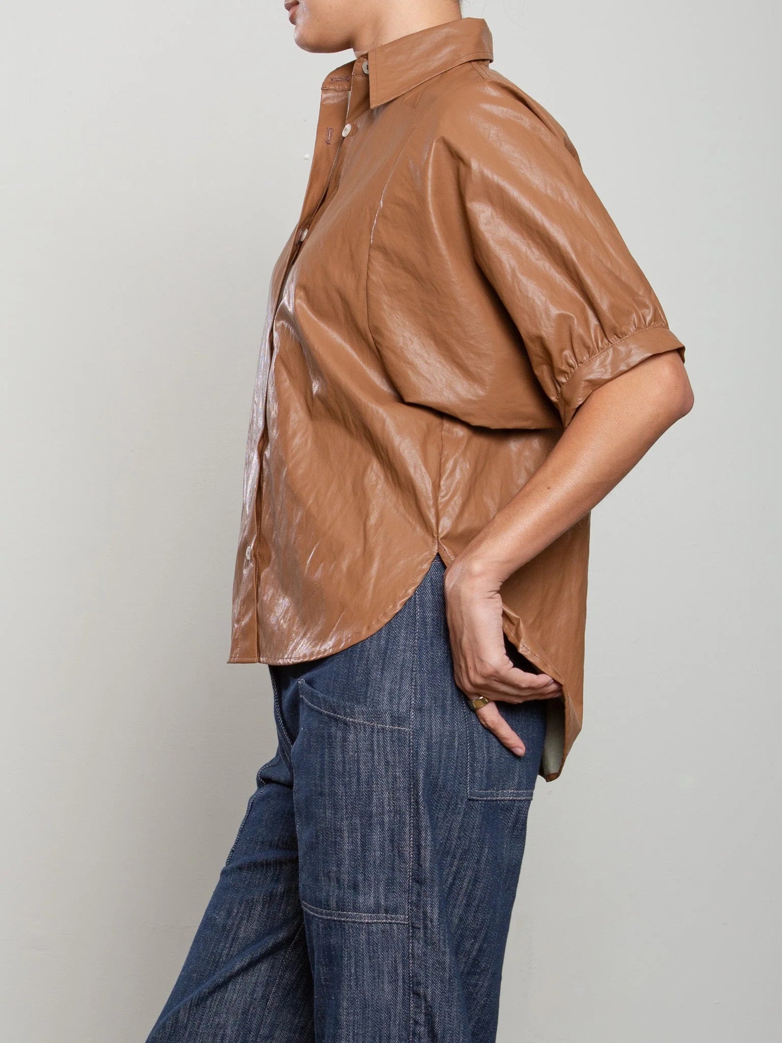 Pharaoh Claude brown button down shirt paired with blue jeans, casual style by Bungalow Furniture &amp; Accessories.