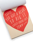 The "150 Love Letters for Your Hunny Bunny" notepad by Sugarboo Designs showcases a red heart with Tom Petty's quote: "'Cause you got a heart so big it could crush this town." Ideal for soul-enlightening love letters that brighten any day.