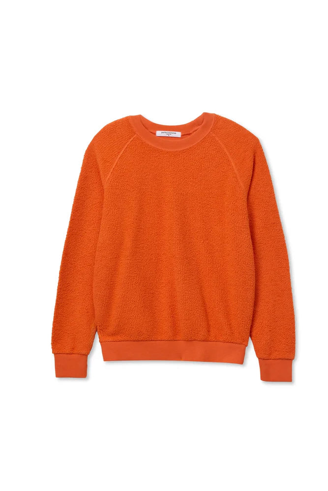 The Ziggy Reverse LS Sweatshirt by Perfectwhitetee in bright orange features a shrunken fit, textured cotton fleece, and ribbed cuffs, collar, and hem. Shown laid flat on a white background.