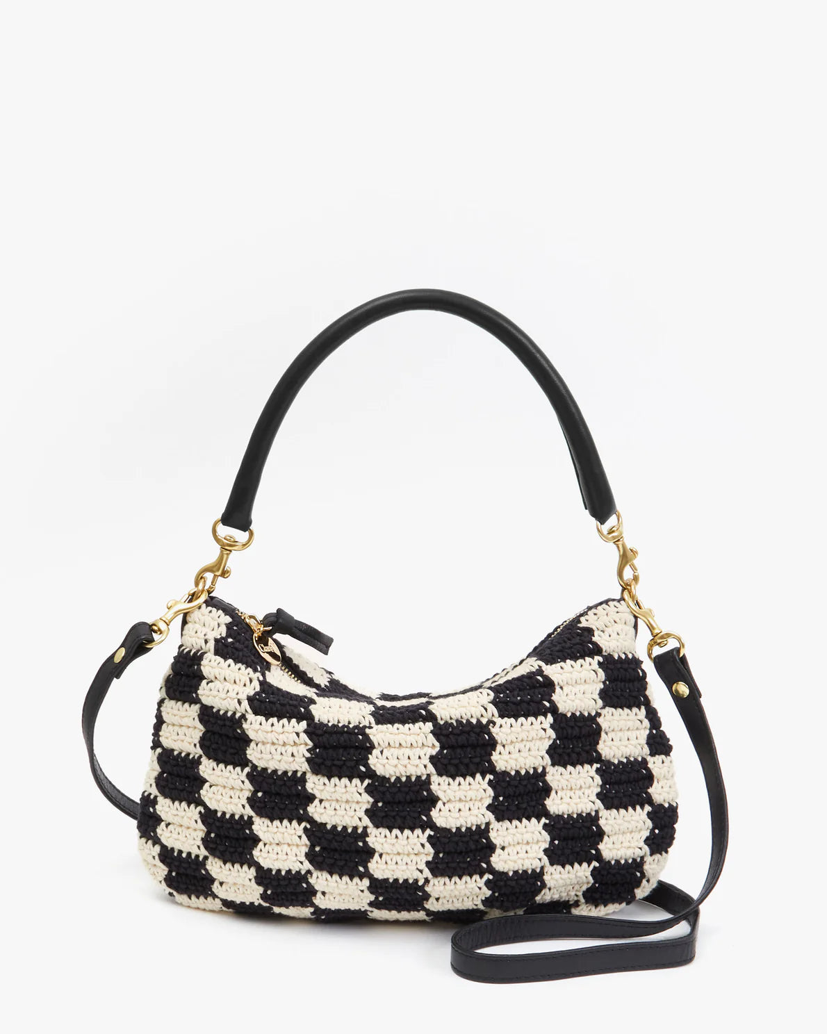 A handcrafted Clare Vivier Petit Moyen Woven Checker mini messenger bag with a black and cream checkered pattern, featuring a detachable black leather shoulder strap and a single black leather handle. The bag includes gold-tone metal hardware and a zipper closure at the top.