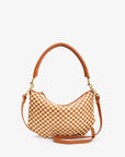 The Clare Vivier Petit Moyen Woven Checker is a stylish brown and white checkerboard handbag, featuring a curved top handle and detachable crossbody strap in rich handwoven leather, with gold-toned hardware. It effortlessly combines elegance with versatility against a white background.