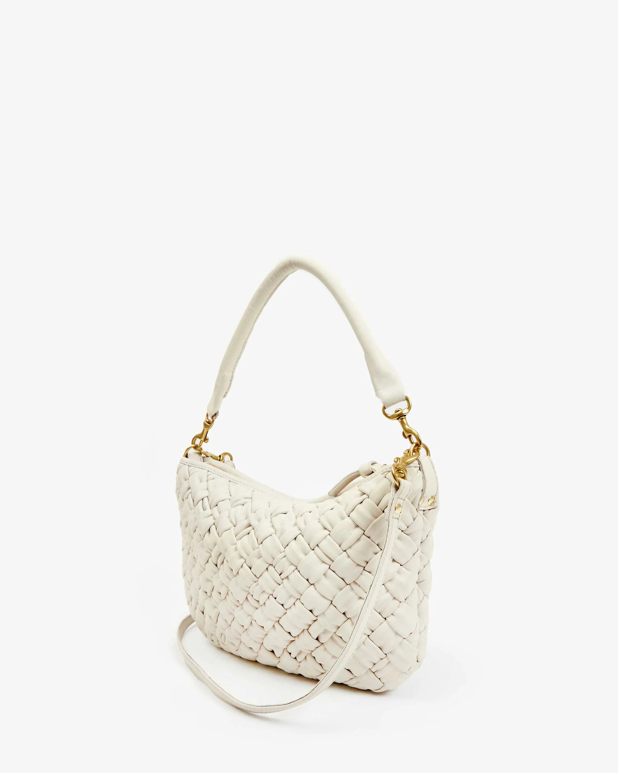 The Petite Moyen S24 by Clare Vivier is a white handwoven leather handbag featuring a curved shape and gold hardware, complemented by tubular straps. The design is minimalistic, showcased against a plain white background.