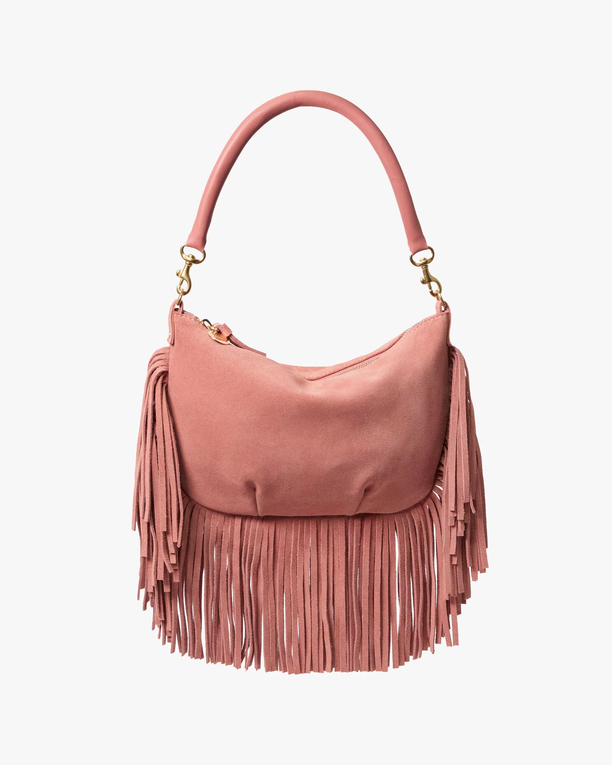 The Clare Vivier Petit Moyen Messenger Suede Fringe is a pink suede mini bag with a curved handle and long fringe detailing on the sides and bottom, displayed against a plain white background.