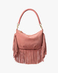 The Clare Vivier Petit Moyen Messenger Suede Fringe is a pink suede mini bag with a curved handle and long fringe detailing on the sides and bottom, displayed against a plain white background.