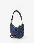 Introducing the Petite Moyen S24 by Clare Vivier: a chic mini messenger handbag with a woven black and blue checkered pattern, accented by elegant gold-tone hardware. It boasts a short handle, detachable crossbody straps, and is beautifully displayed against a plain white background.