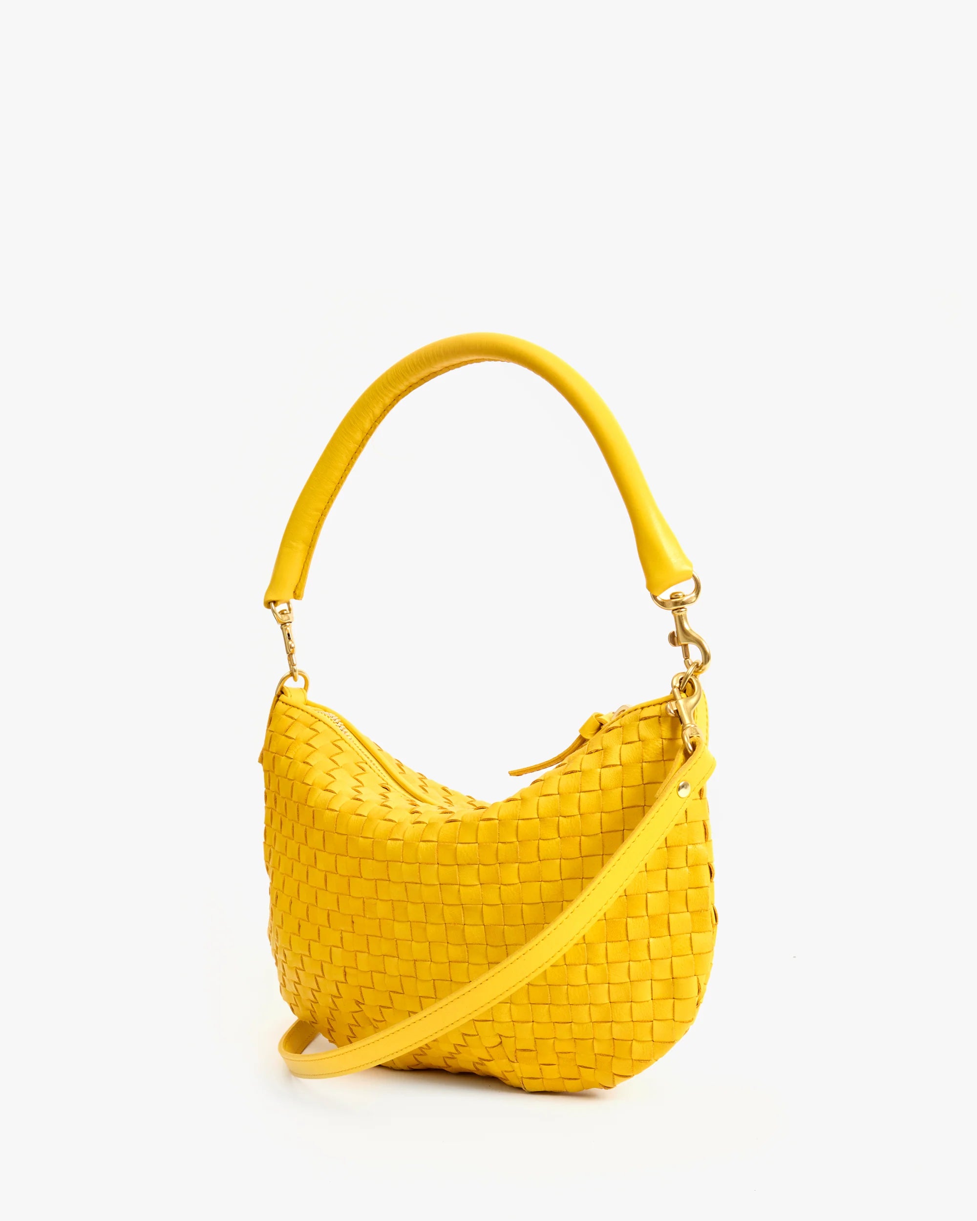 The Clare Vivier Petit Moyen Messenger S25 is a bright yellow handwoven leather mini messenger bag with a short handle and detachable crossbody straps, shown upright on a plain white background.