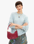 Clare Vivier Petit Moyen Messenger 26, red leather crossbody, styled with blue sweater and gray doodle pants.