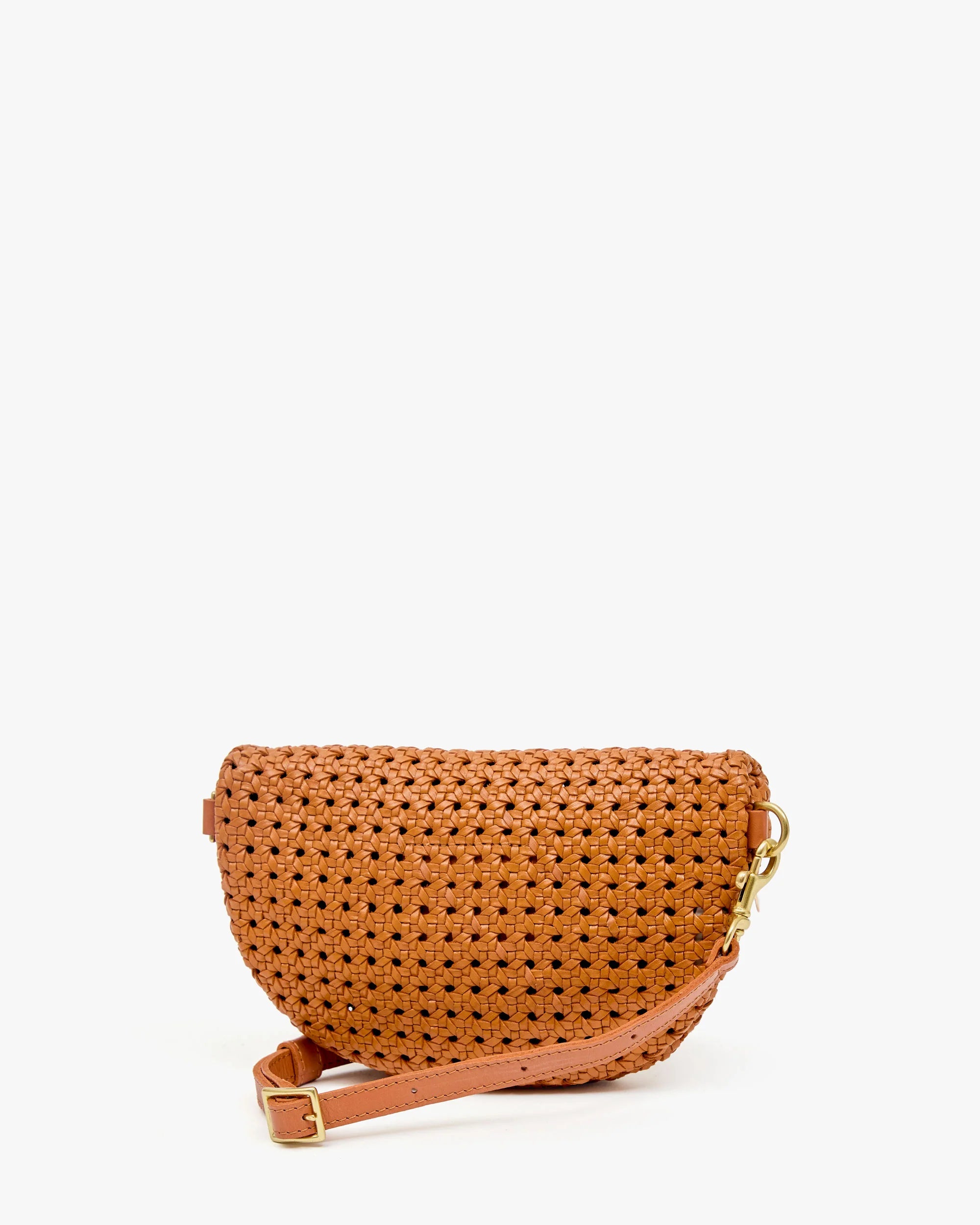 The Clare Vivier Petite Fanny S26 is a small brown handwoven leather crossbody bag with a pink adjustable strap and gold buckle, shown upright on a plain white background.