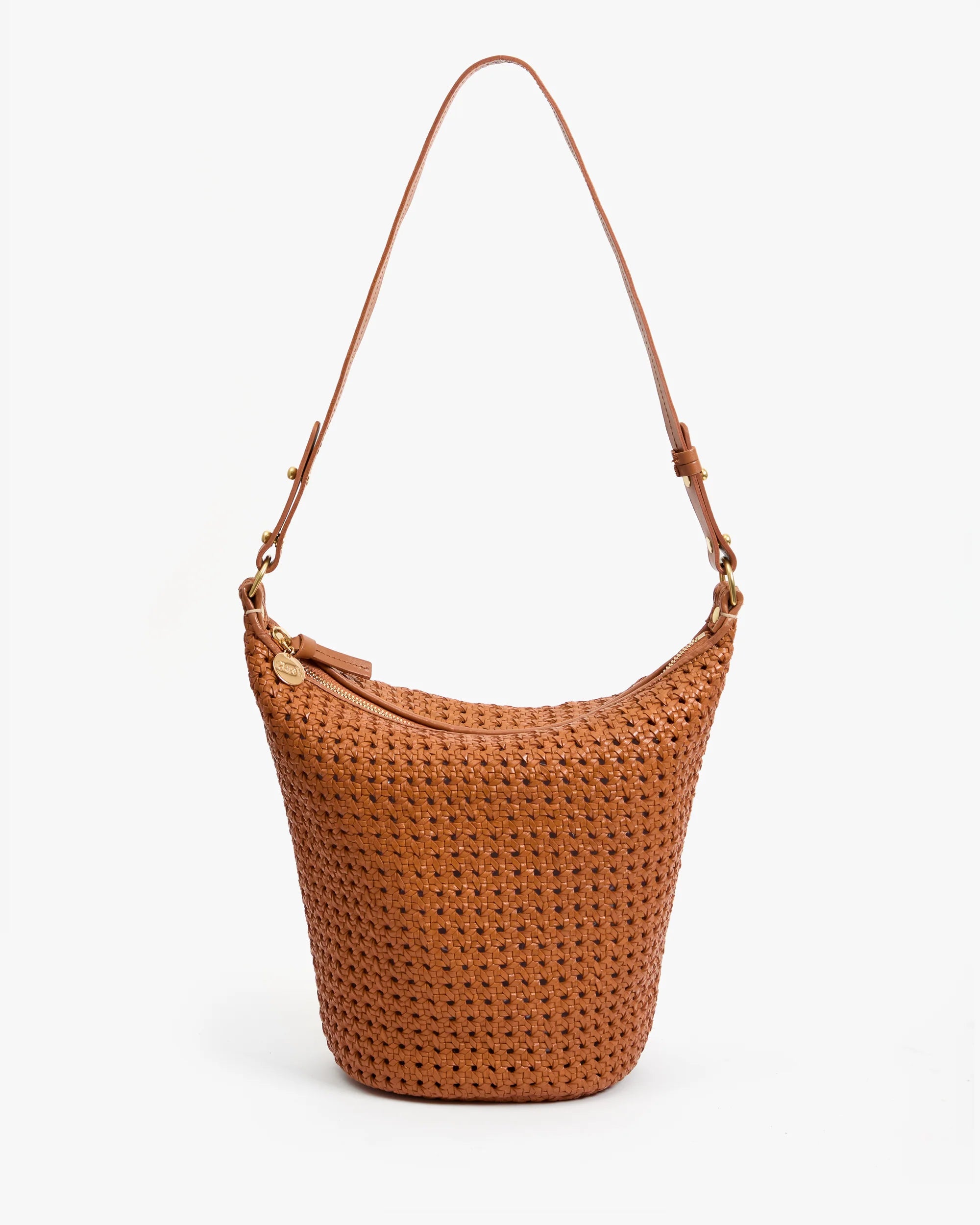 The Petit Jeanne by Clare Vivier is a brown handwoven leather shoulder bag featuring a single adjustable strap and a gold zipper, shown against a plain white background.