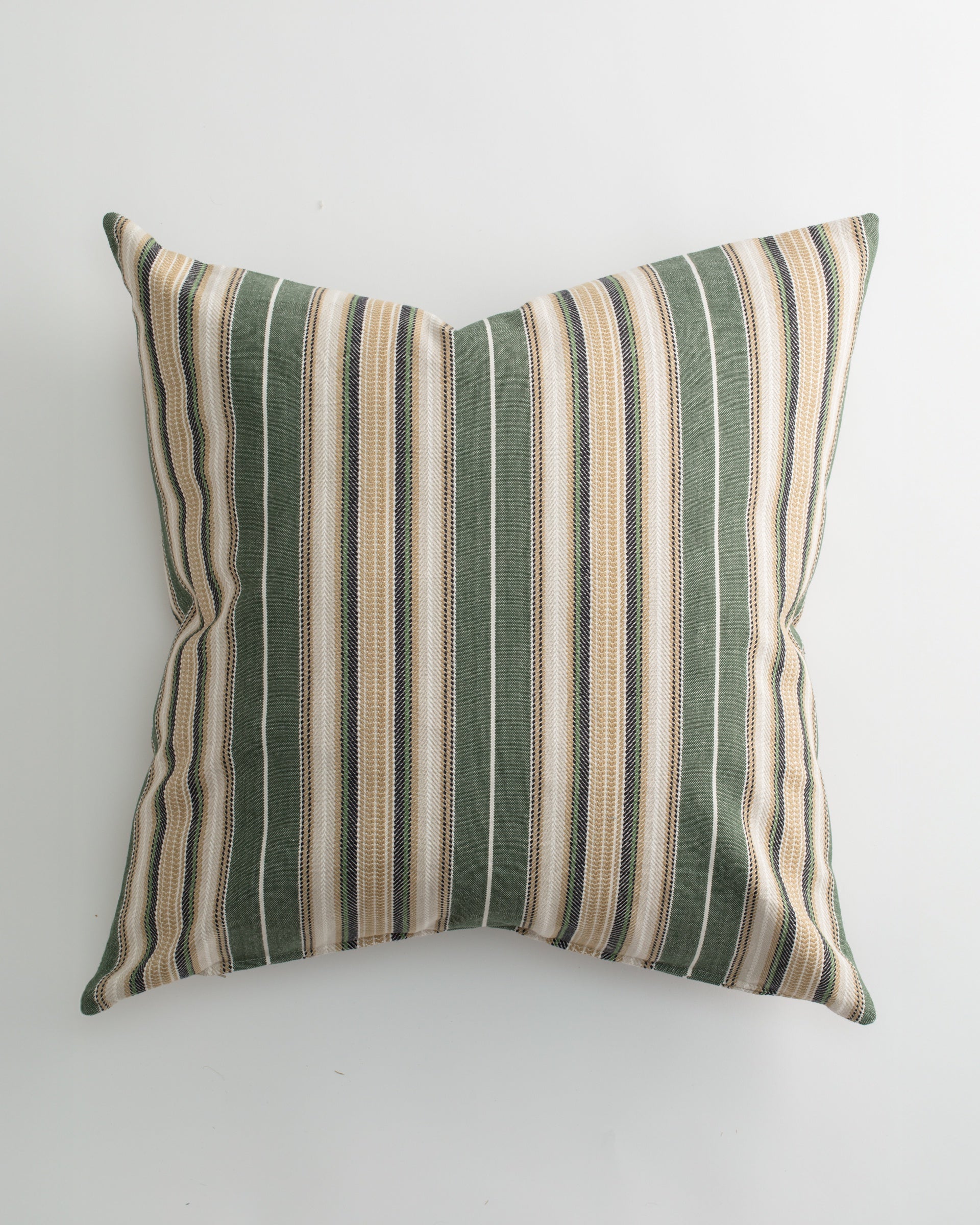The Pindler CARPENTER 26x26 Pillow features vertical green, beige, and white stripes on a light background. This custom-made throw pillow has slightly pointed edges for a plump, elegant look and firm support. Photographed from above.