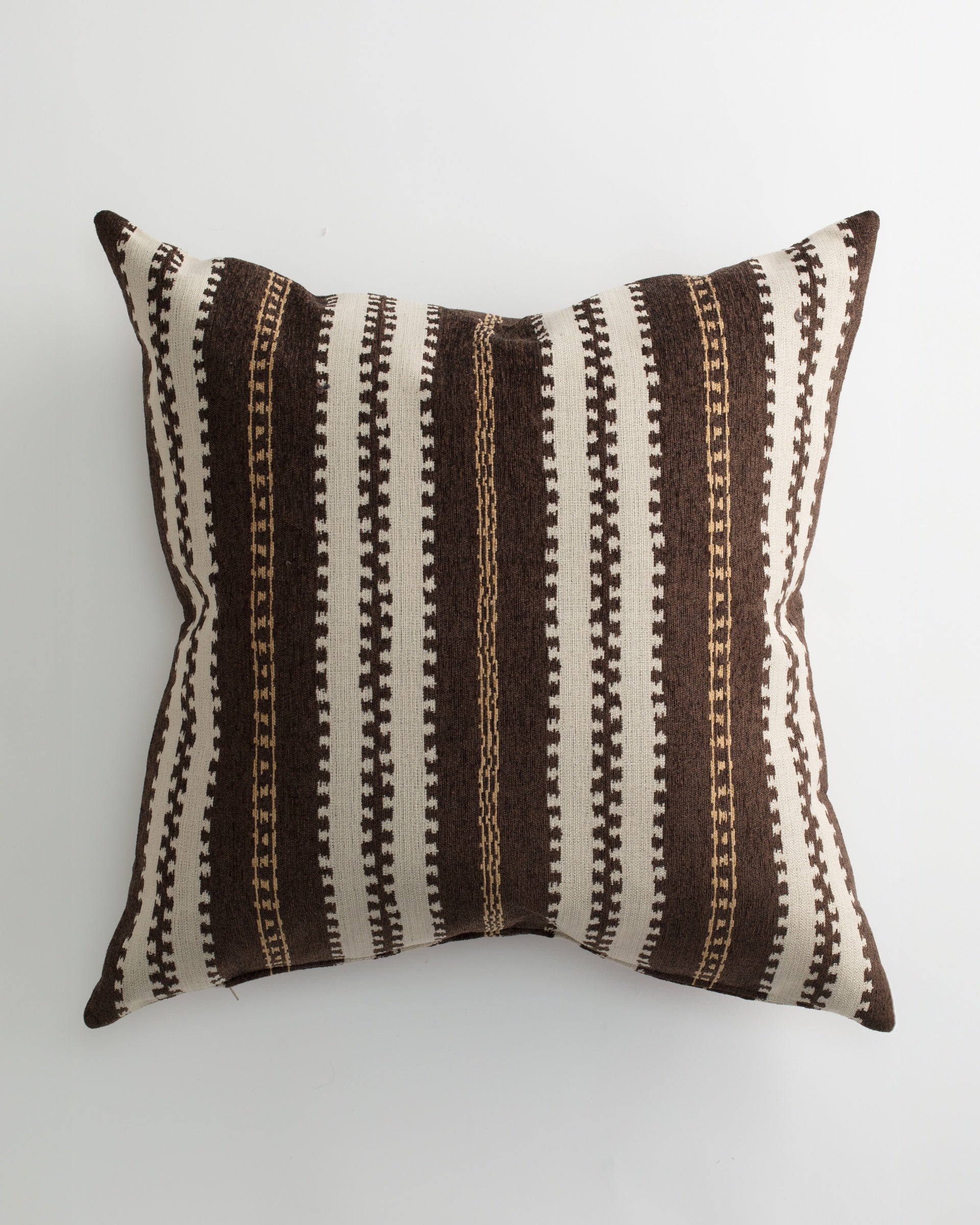 The Pindler CORDELE 26x26 Pillow features a woven cover with vertical stripes in brown, cream, and tan plus geometric patterns for a textured, handcrafted look. Includes a down insert to add luxury to your home decor.