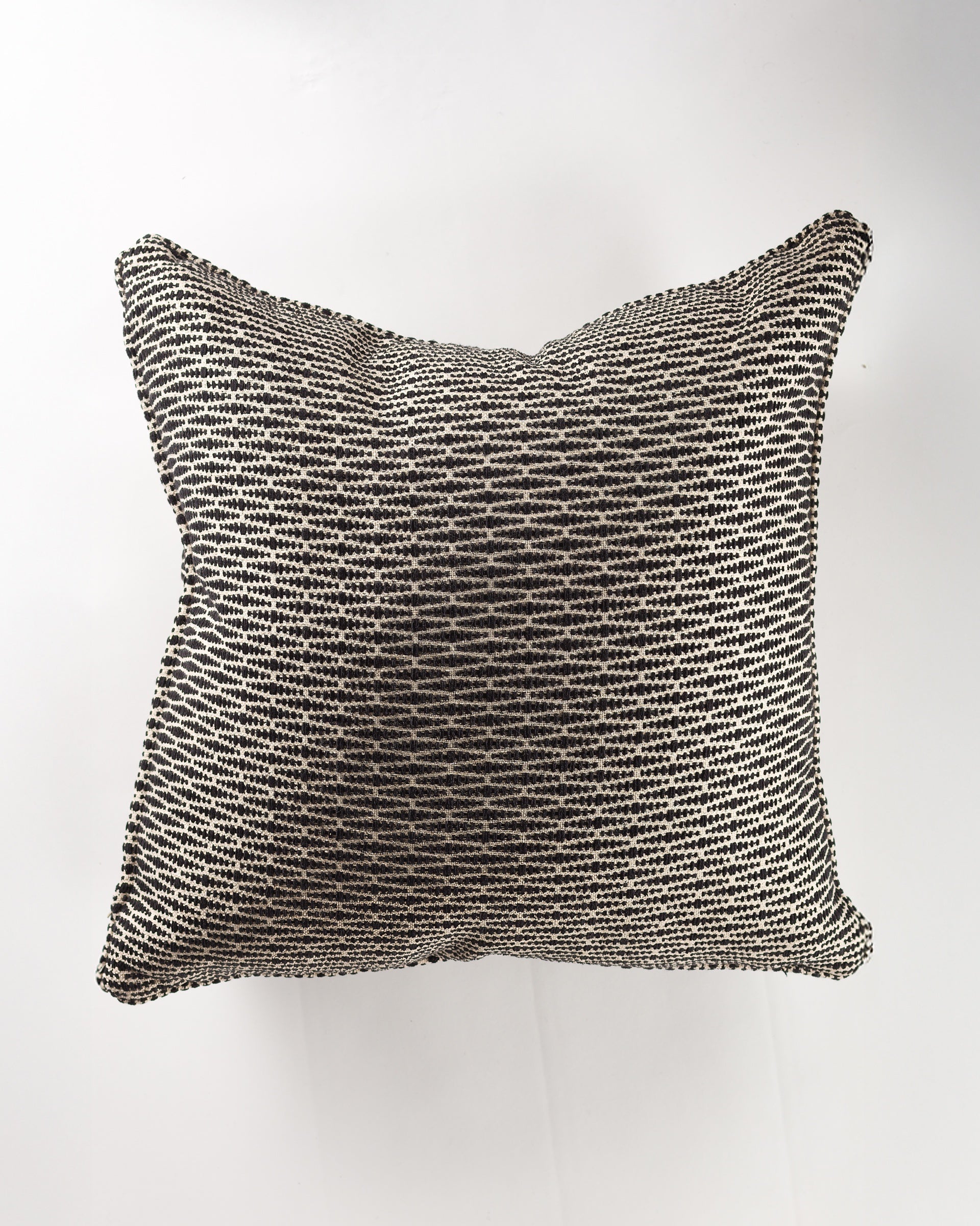 The Gabby Beatrix Black Gr-6 Pillow 26x26 features a textured black and white woven design, shown on a white background—ideal for pairing with euro pillows to add a luxurious touch.