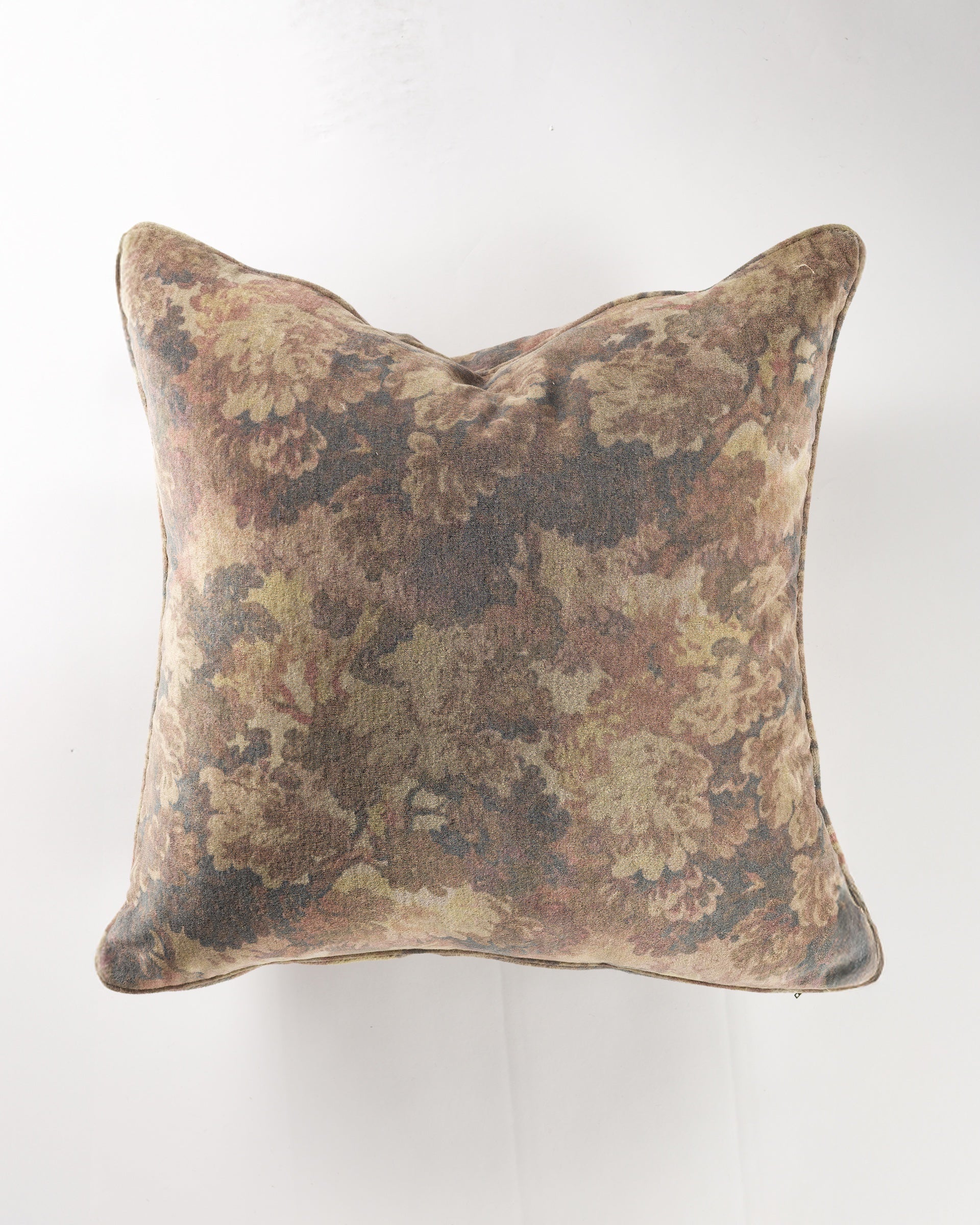 The Gabby Foliage Chocolate Gr-10 Pillow 26x26 features a muted brown, green, and tan floral pattern on white, and includes a plush insert for extra comfort.