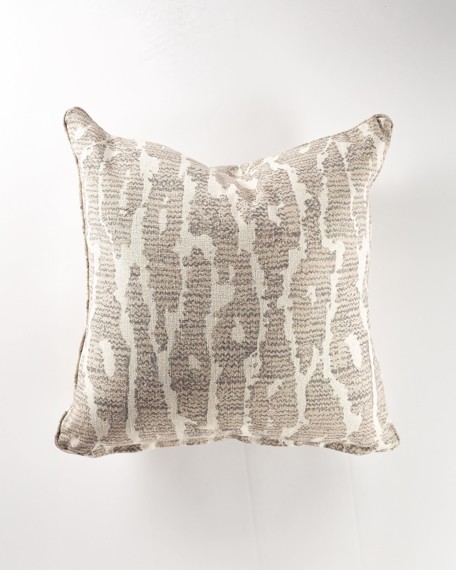 The Trax Smoke Gr-8 Pillow 26x26 by Gabby features a neutral beige and cream abstract pattern with vertical streaks, making it an elegant addition to your luxurious pillow collection.