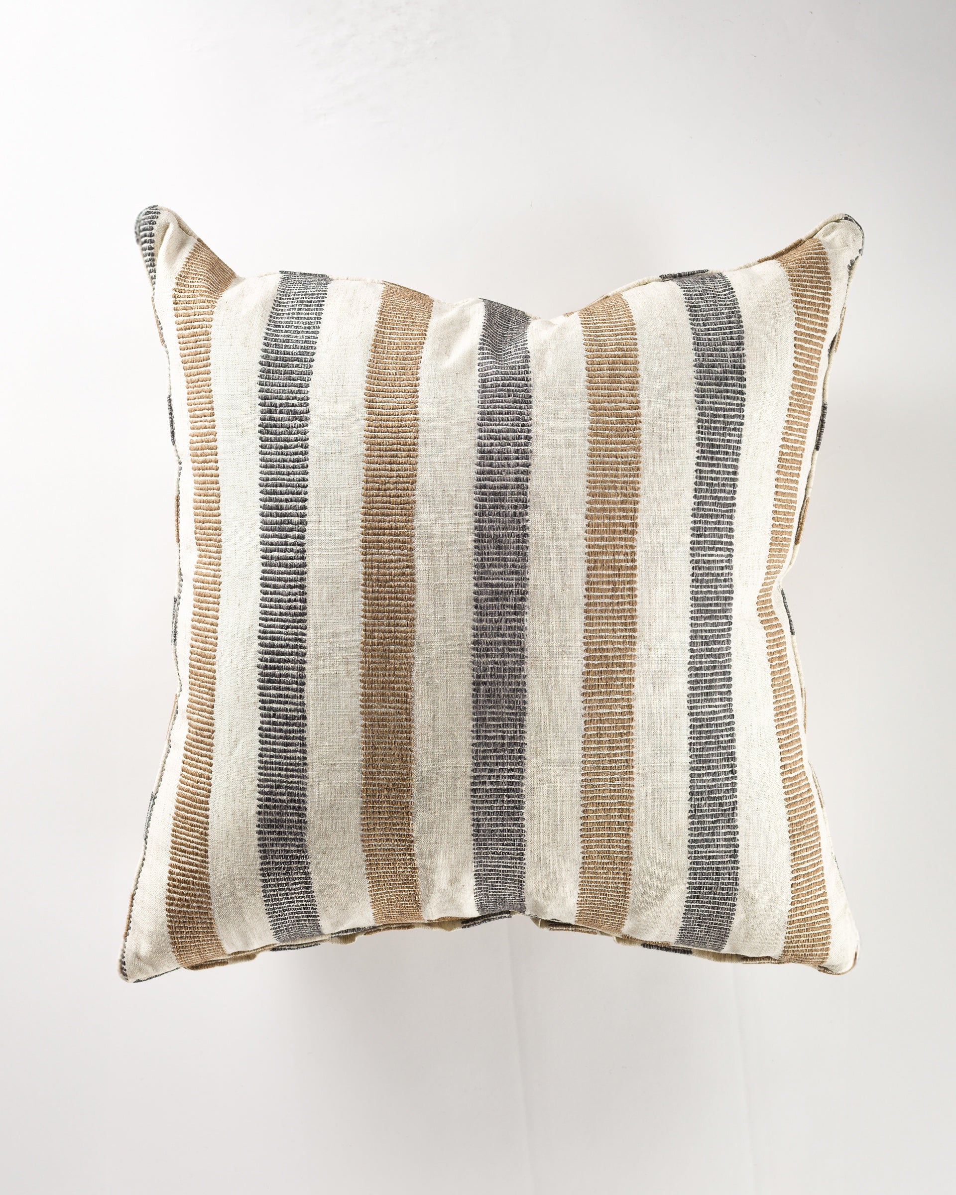 The Flores/Natural Gr-5 Pillow 26x26 by Gabby features vertical beige, brown, gray, and off-white stripes on a white background—perfect for adding style to your luxurious pillows or pairing with your favorite insert.