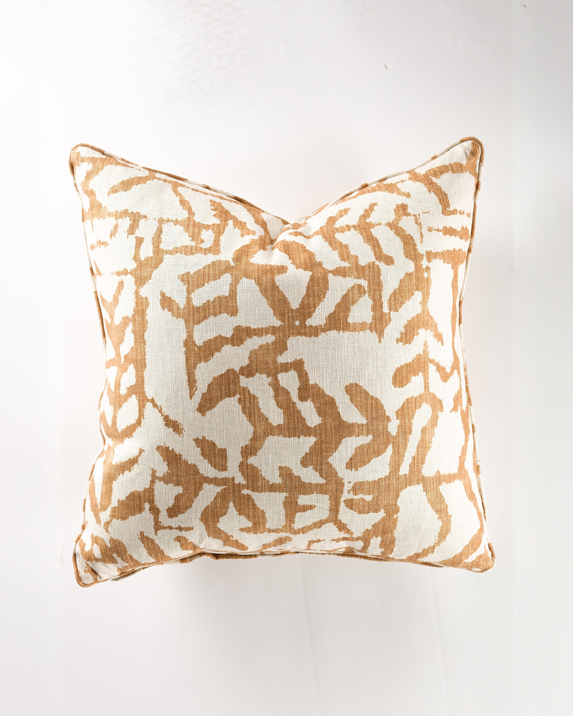 The Gabby Inkblot Camel Gr-3 Pillow 26x26 features a beige and white abstract design. Shown from above on a white background, this decorative euro pillow includes a supportive insert for long-lasting comfort and style.