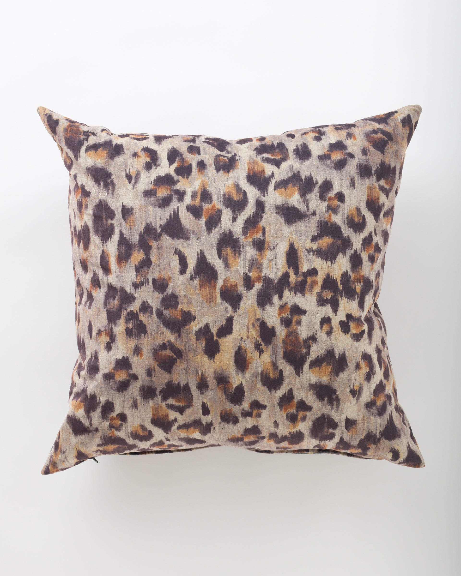 The Pindler Samira 26x26 pillow features a brown, beige, and black leopard print on a light background—ideal for pairing with euro pillows or elevating your decor with bold style.